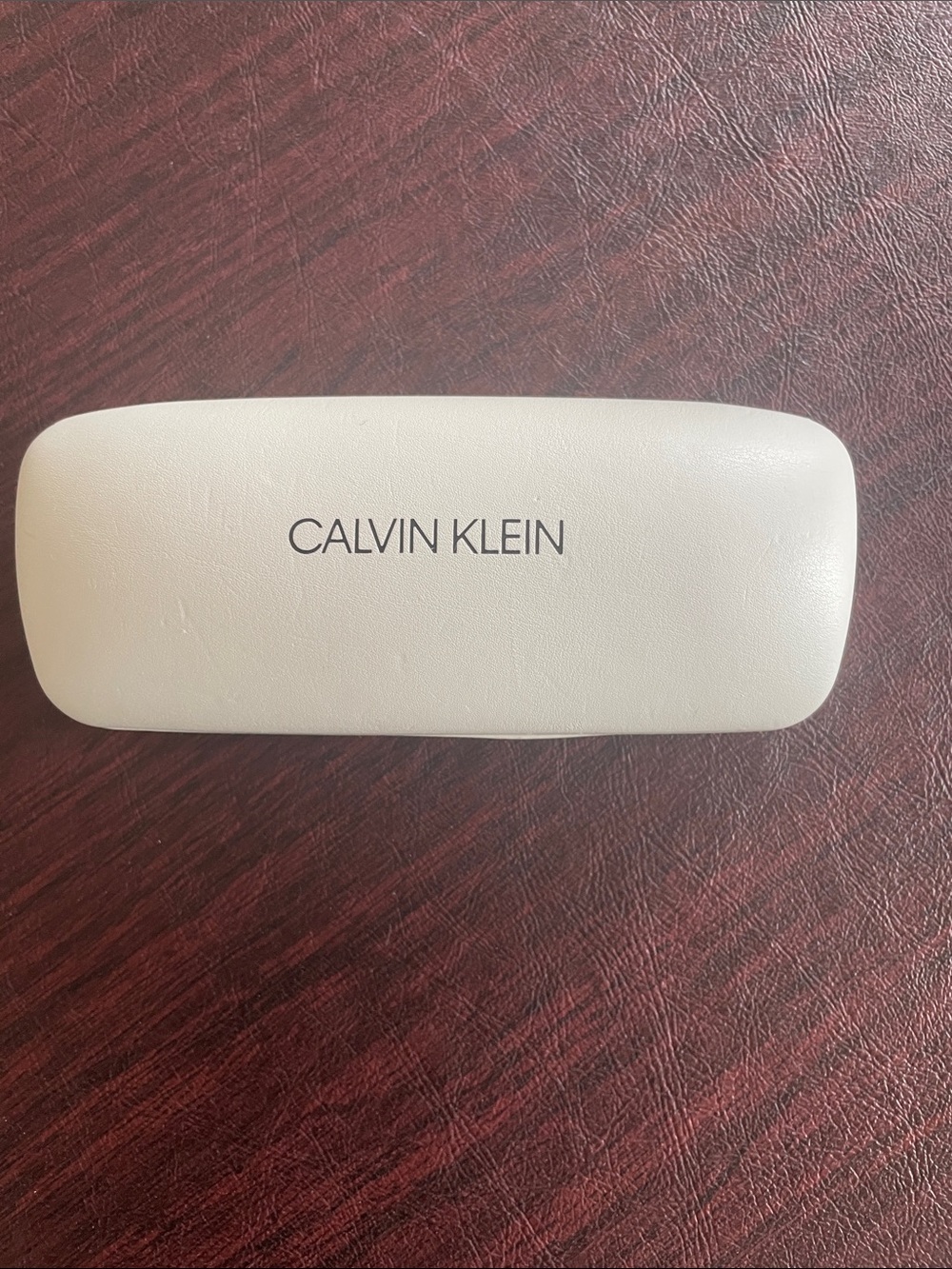 Calvin Klein sunglasses case.
